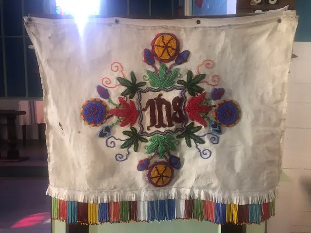 Beaded altar frontal with IHS design